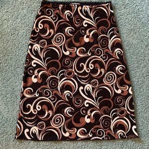 A. Byer size M polyester black skirt with cream and brown flourishes